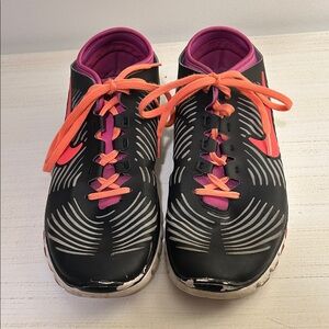 Nike Women’s Black Athletic Shoes with Pink Accents and Orange Laces